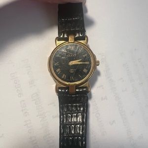 Circa 1990 Gucci watch. Gold with brown Crocco band. Needs new battery.